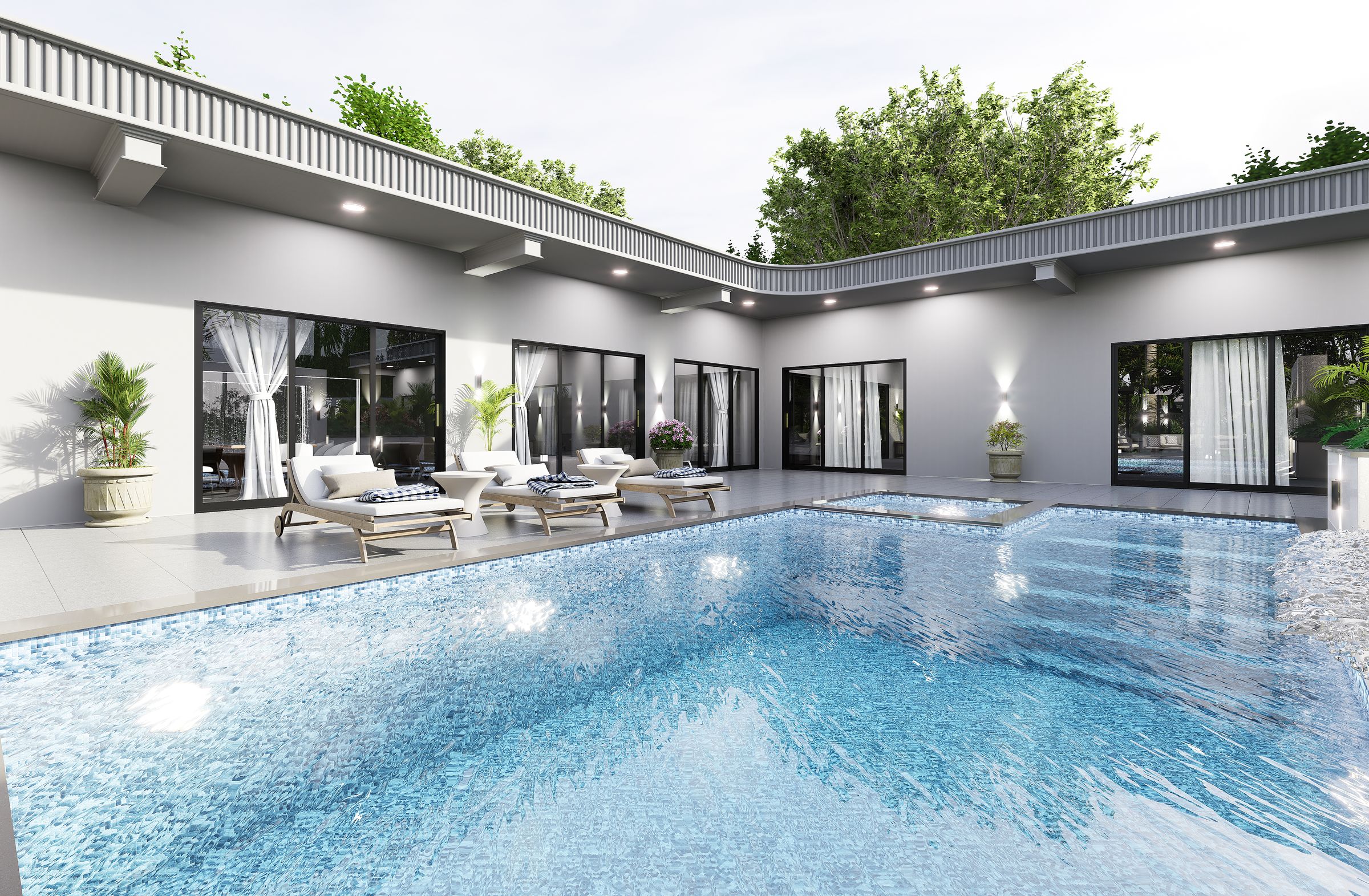 Pool terrace of a single-storey farmhouse